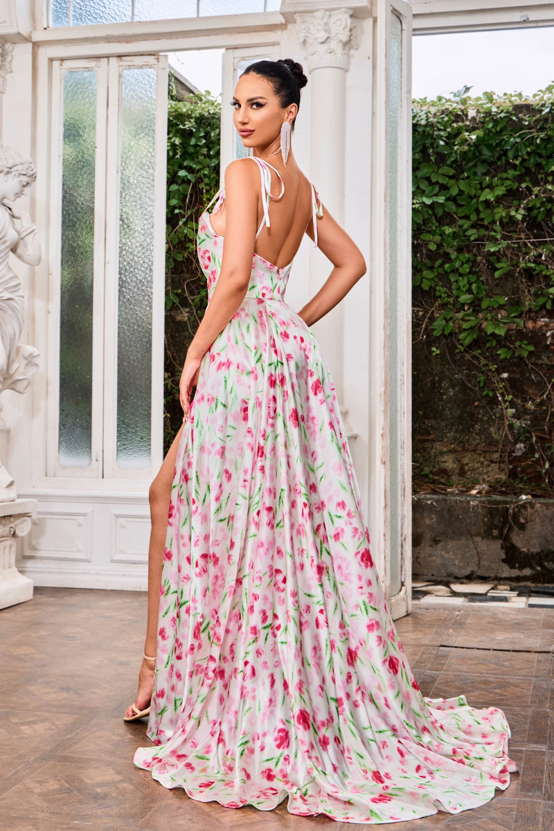 This dress features a draped neckline, spaghetti straps with ties, an A-line silhouette and a printed fabric. This dress is stunning choice for your next prom or formal event.  JAD J24019