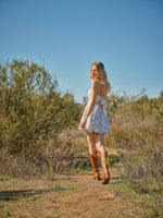 This cocktail dress features a strapless neckline with textured jacquard floral fabric and a voluminous pleated pumpkin hem with an oversized back tie detail. Style this dress to make it your own at your next homecoming or formal event.

BLB 36948D