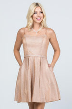 This LU 25655 rose gold flowy short dress has pockets and shimmer fabric.