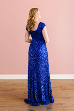 This stunning modest fully sequin gown features a cap sleeve design with a high back. The waistline of this dress hits the perfect place and paired with simple accessories, will make you stand out at your next event. Choose this gown if you're looking for more coverage without sacrificing style.  LA 29322