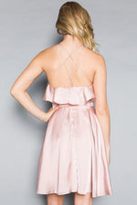 This MT 8921 cocktail dress in mauve features a ruffle on the bodice, a flowy skirt, and a strappy criss-cross back. 