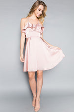 This MT 8921 cocktail dress in mauve features a ruffle on the bodice, a flowy skirt, and a strappy criss-cross back. 