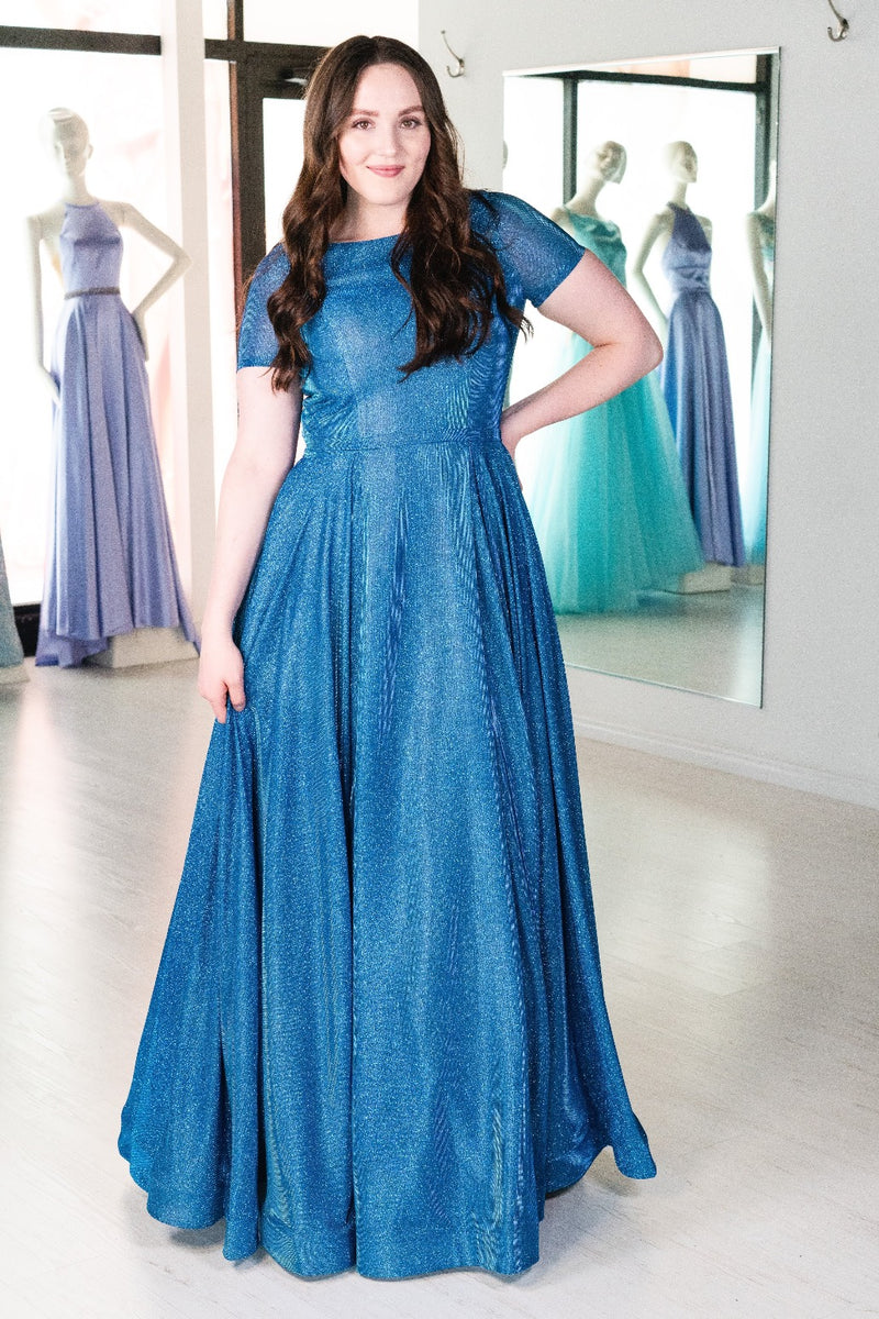 This MJS 19-262M A-line gown in royal features cap sleeves and a high neckline. 