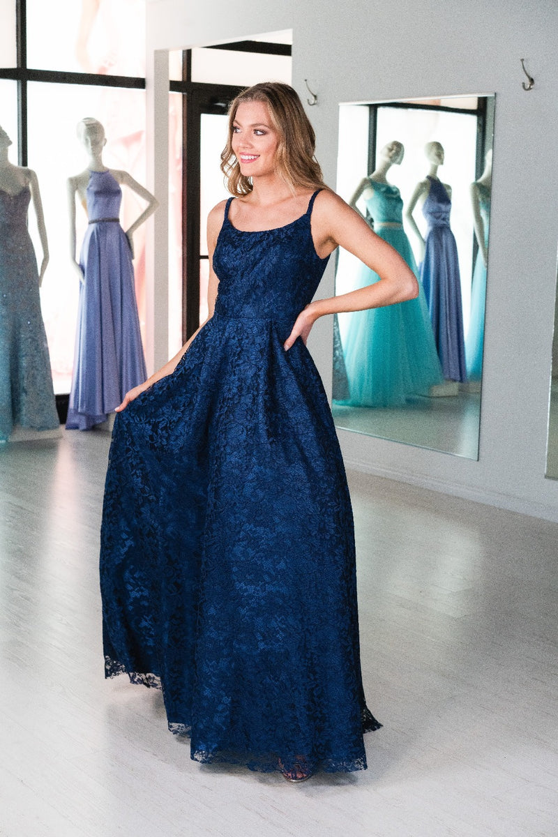 This. DJ A9361 simple lace gown in navy features a straight neckline and an open back. 