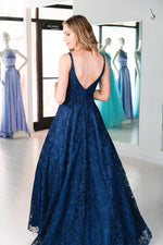 This. DJ A9361 simple lace gown in navy features a straight neckline and an open back. 