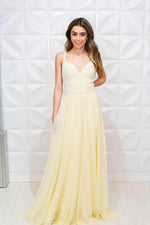 This Sherri Hill 53556 gown in yellow/ivory features a beaded bodice with a sweetheart neckline. 