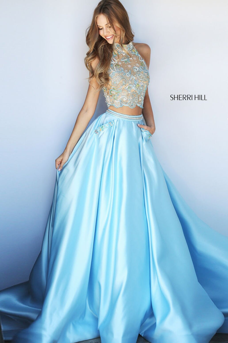 This Sherri Hill 51041 light blue two-piece ballgown has a halter and beaded bodice.