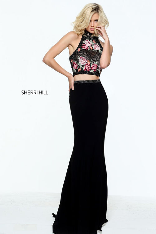 This Sherri Hill 51059 black fitted boho gown has a floral print bodice and fitted skirt.
