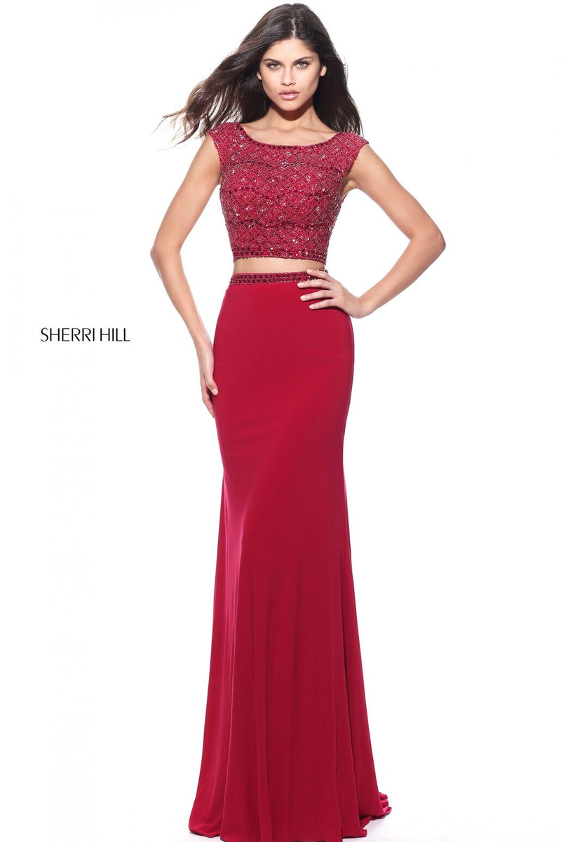 This Sherri Hill 51125 ruby fitted two-piece gown has a beaded bodice and simple skirt.