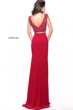This Sherri Hill 51125 ruby fitted two-piece gown has a beaded bodice and simple skirt.