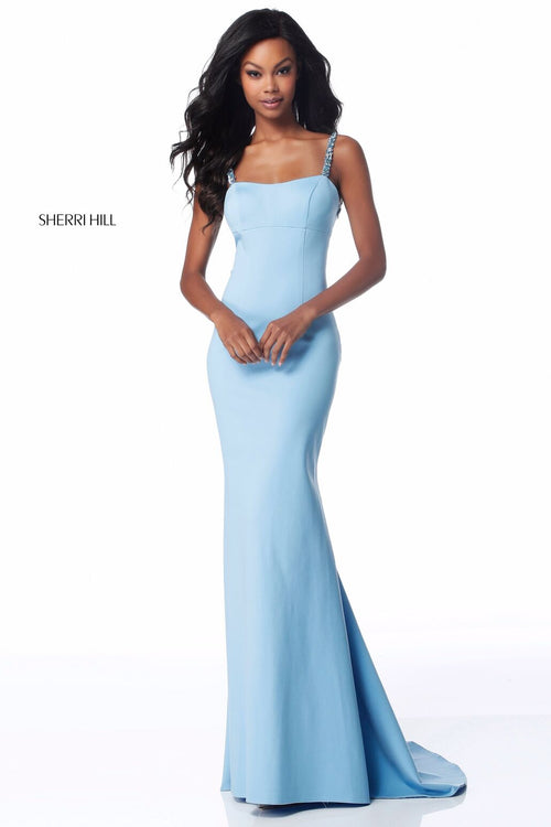 This Sherri Hill 51777 fitted jersey gown in light blue features bead encrusted straps and an open back.