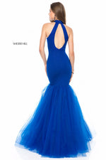 This Sherri Hill 51779 mermaid gown in royal features beading, a tulle skirt, and a high neck.