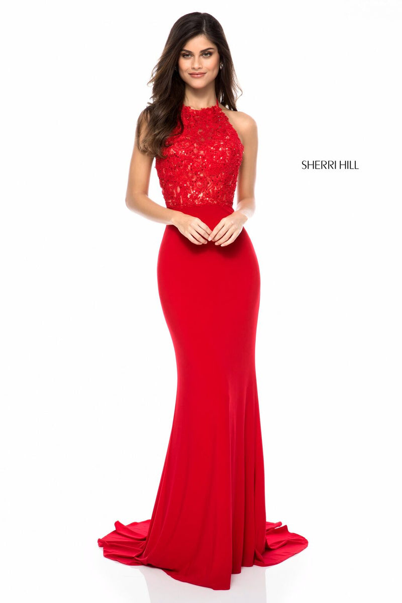This Sherri Hill 51844 gown in red features a lace appliqué halter bodice and a jersey skirt with an open back.