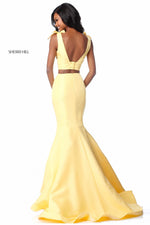 This Sherri Hill 51918 taffeta mermaid two-piece gown in yellow features bows on the shoulders and buttons on the back.