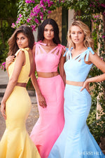 This Sherri Hill 51918 taffeta mermaid two-piece gown features bows on the shoulders and buttons on the back.