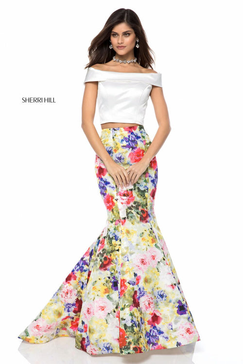 This Sherri Hill 52005 two piece mermaid gown with bold printed skirt is perfect for your next dance.
