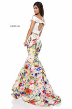 This Sherri Hill 52005 two piece mermaid gown with bold printed skirt is perfect for your next dance.