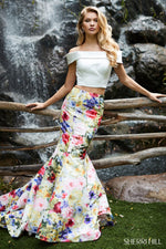 This Sherri Hill 52005 two piece mermaid gown with bold printed skirt is perfect for your next dance.