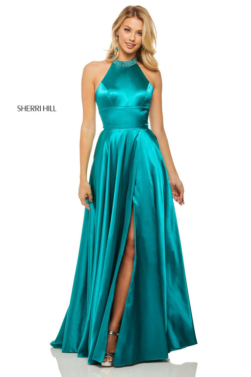 This Sherri Hill 52920 teal satin gown features a high-neck halter bodice and a side slit.