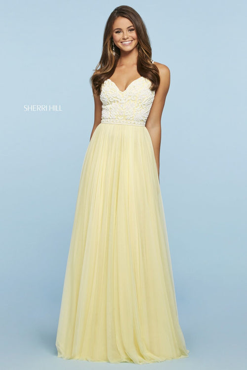 This Sherri Hill 53556 gown in yellow/ivory features a beaded bodice with a sweetheart neckline.
