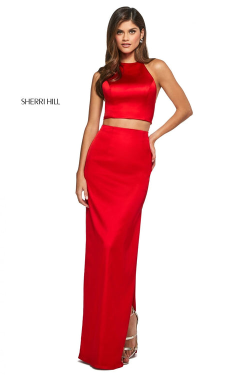 This Sherri Hill 53650 mikado two piece gown in red features a high cut halter style top and a long skirt with side slits. 