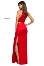 This Sherri Hill 53650 mikado two piece gown in red features a high cut halter style top and a long skirt with side slits. 