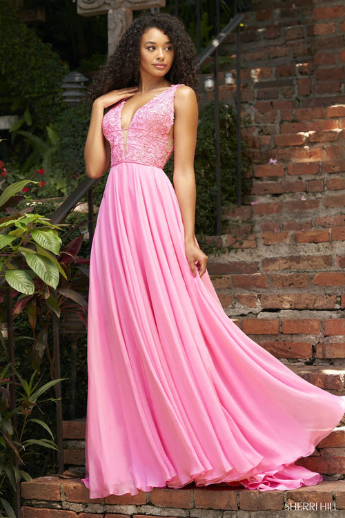 A Sherri Hill prom dress with a chiffon skirt, lace bodice and deep v neckline. 