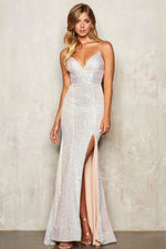 This Sherri Hill dress features sequin fabric, fitted silhouette with sweetheart neckline, lace up back and skirt slit.